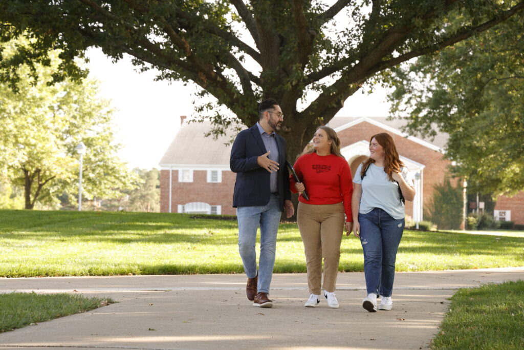 Teacher walking with students outside