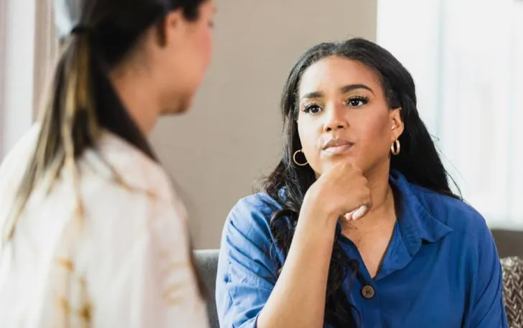 Counselor listening to a patient