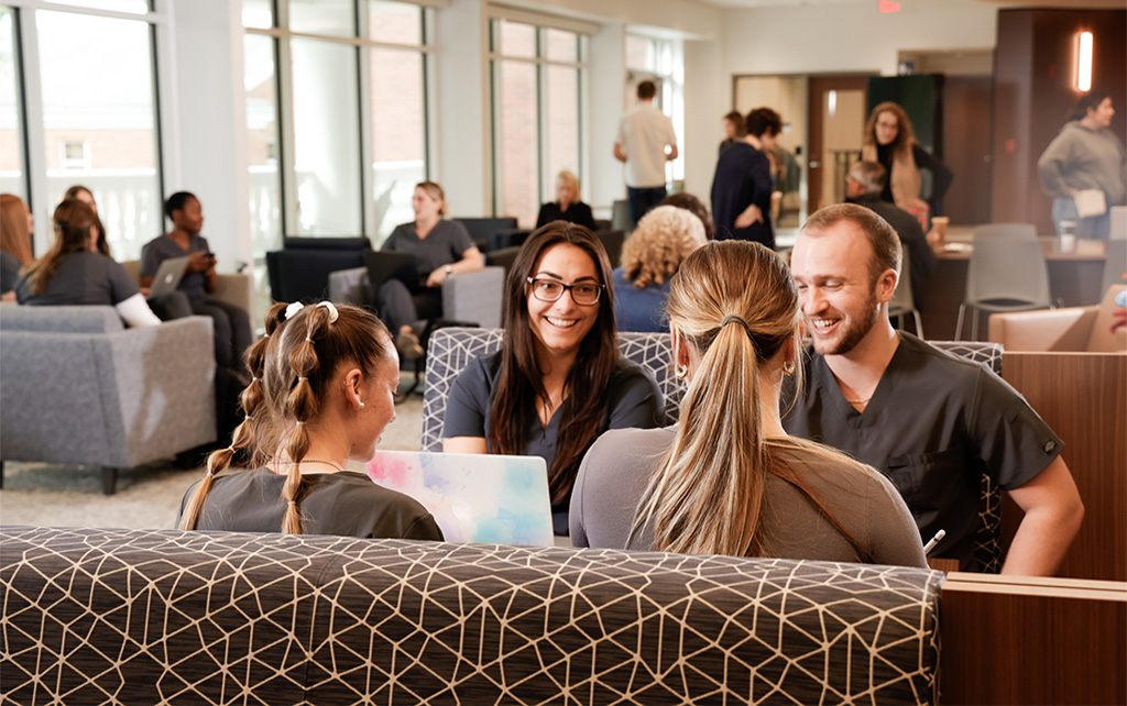 Nursing students in a group talking