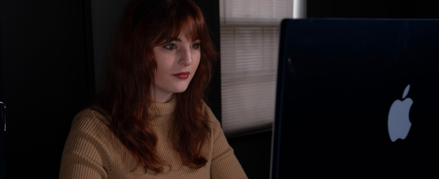 Woman sitting in front of a computer