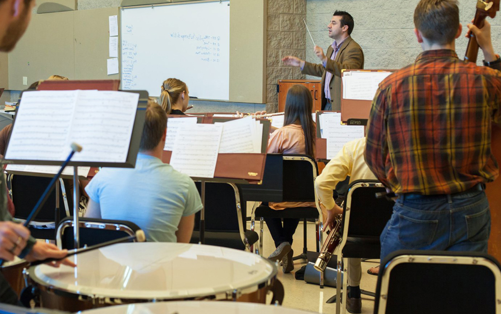 Teacher and students in music class