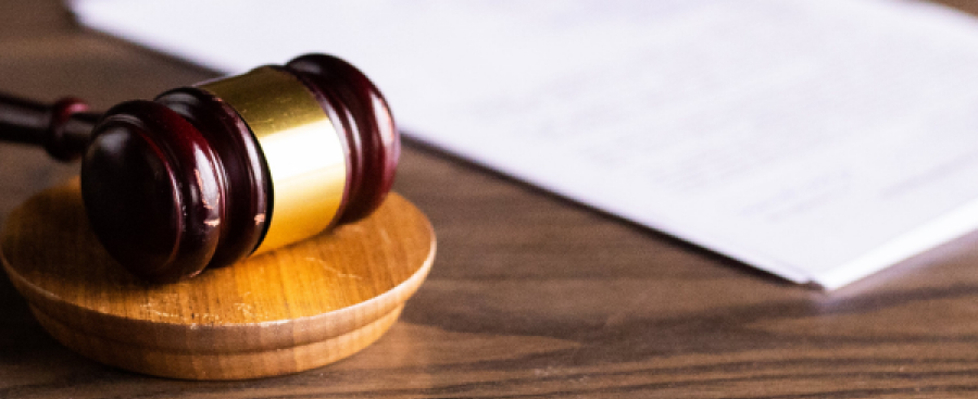 Paper and a gavel on a desk