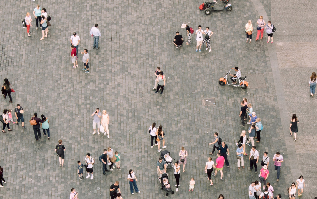 Aerial view of city square with people walking