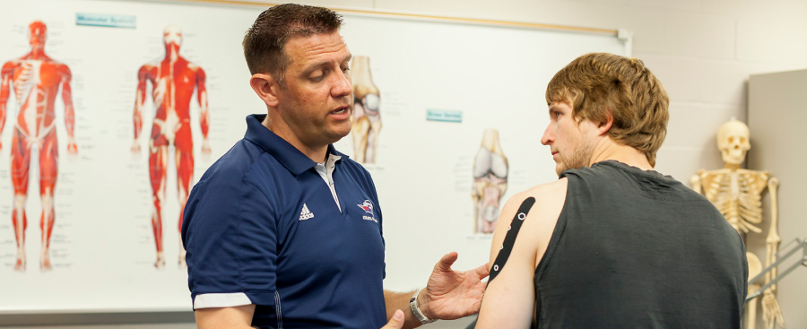 Chris Crawford working with a student athlete