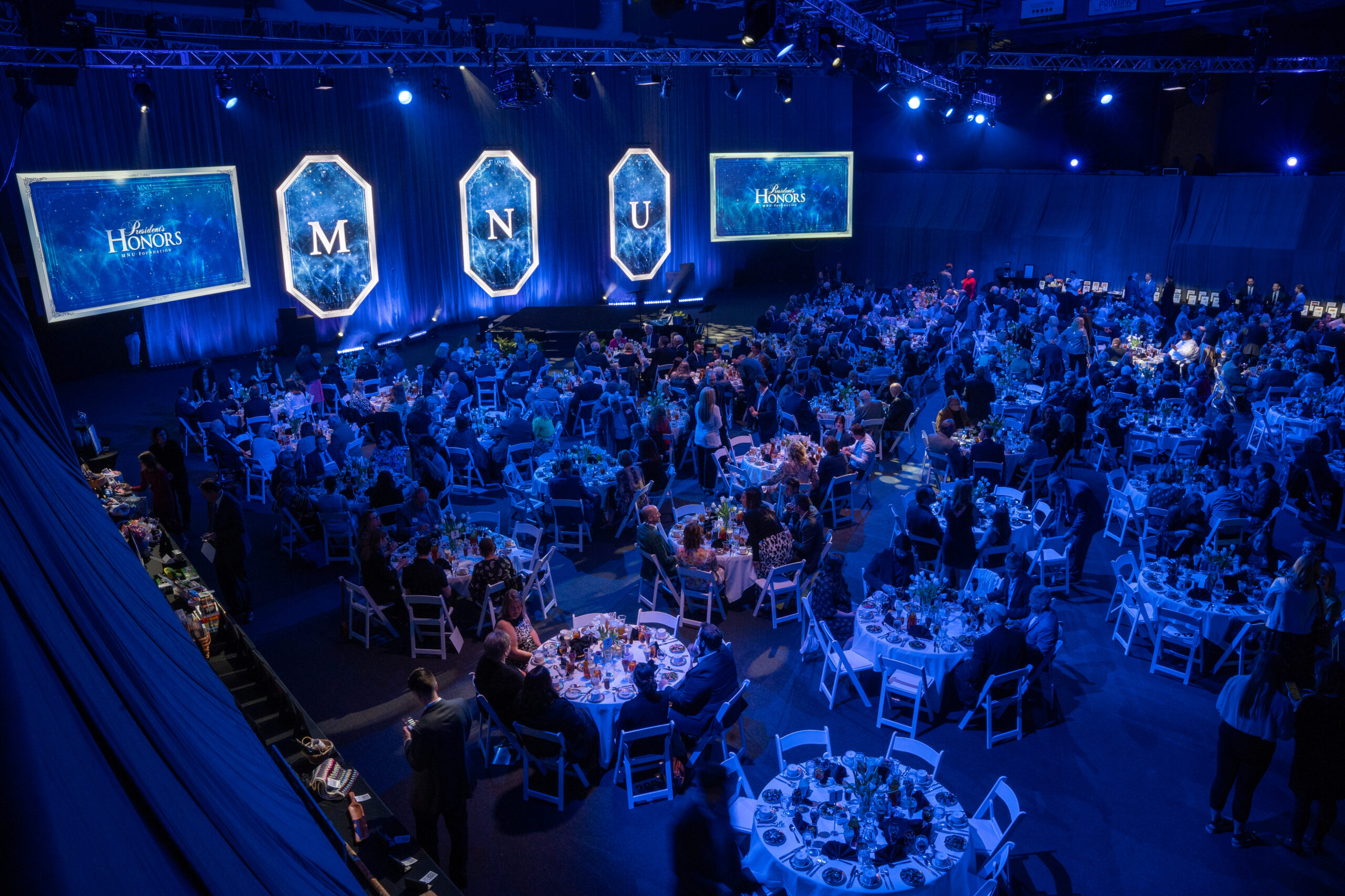 Main floor with guests at tables, 2024 President's Honors