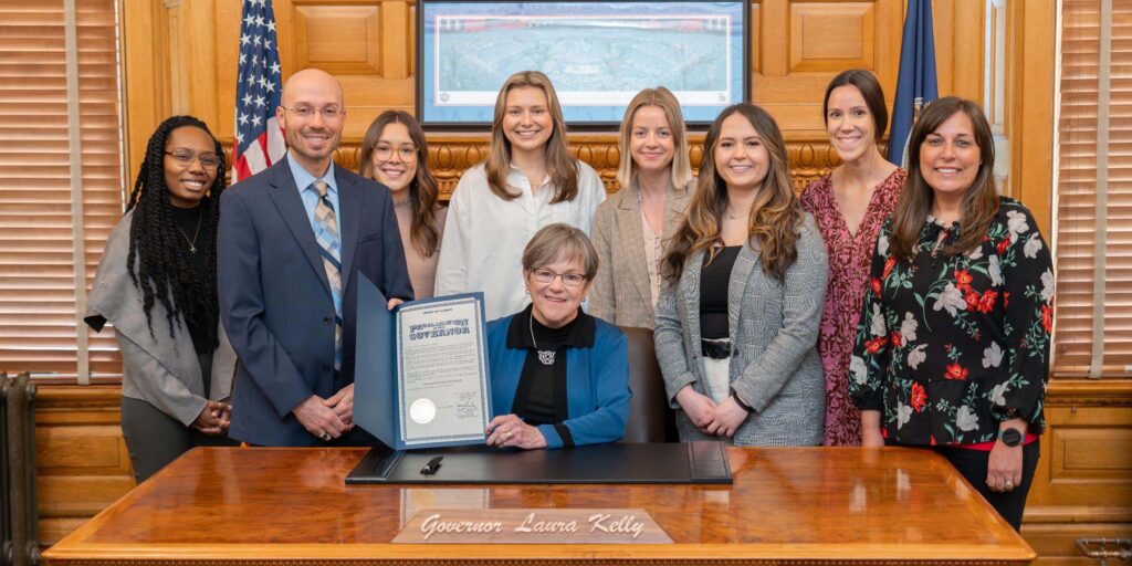 MNU students with Kansas Gov. Laura Kelly, Prof Andrew Secor and Jennifer Secor.