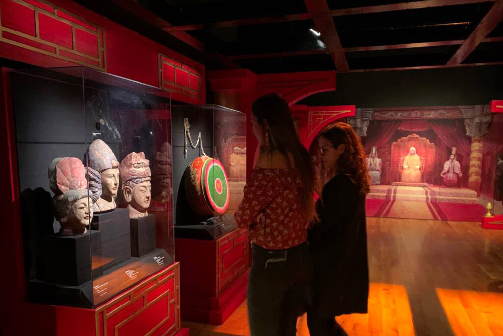 Students looking at an exhibit in a museum