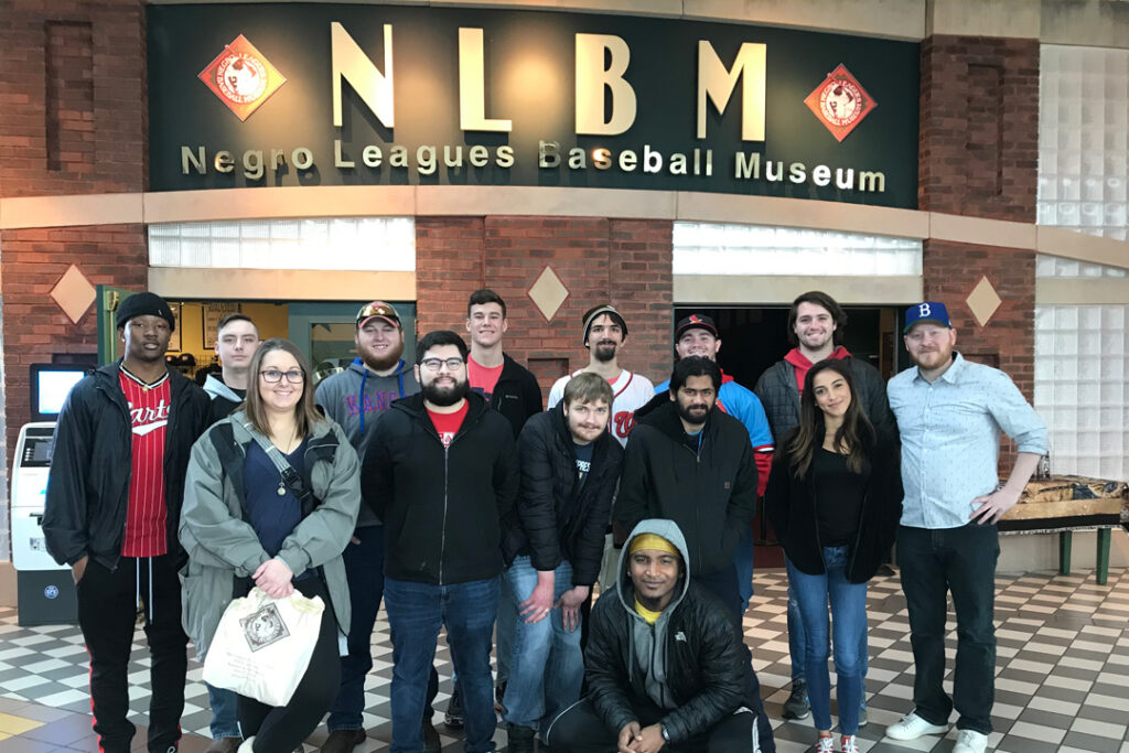 Students posing in front of the entrance to the Negro League Baseball Museum