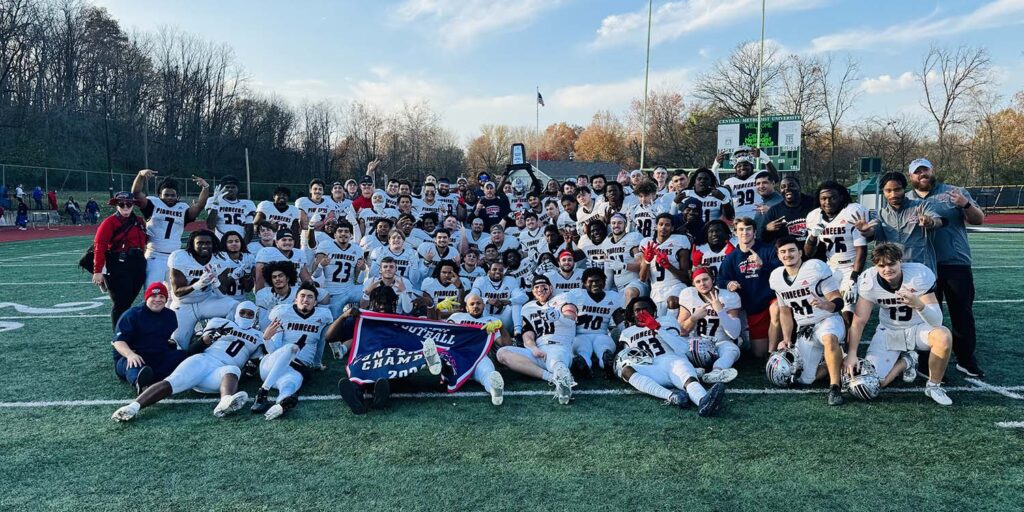 2024 Pioneer Football Team poses after clinching conference championship